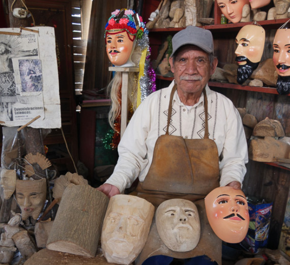Pavel Shlossberg with some Mexican masks at the Northest Museum of Arts and Culture