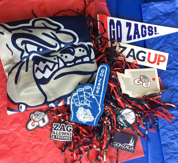 Zag Swag: GU Flag, Zag Up sticker, WA Bulldog sticker, Mini white “Go Zags!” pennant, Pop magnets, Pom pom, Blue mini foam finger