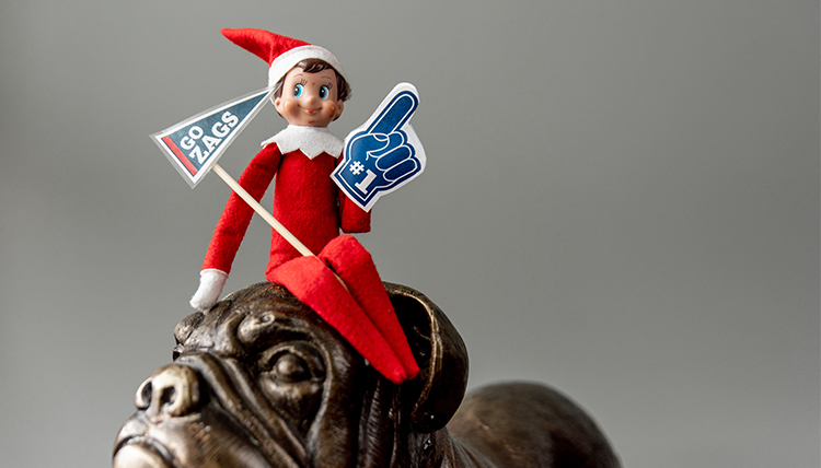 Elf on a bulldog with Gonzaga Signs