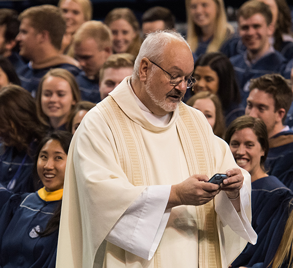 Father Brad Reynolds at commencement 