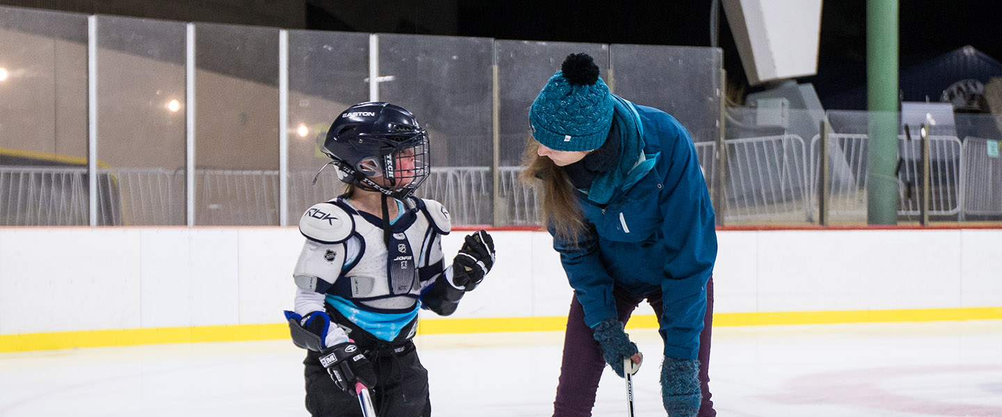 Gonzaga students, working with GU Professor Mark Derby, help youth in the Gonzaga Exceptional Hockey Program at Riverfront Park Ice Arena on Nov. 20, 2015.