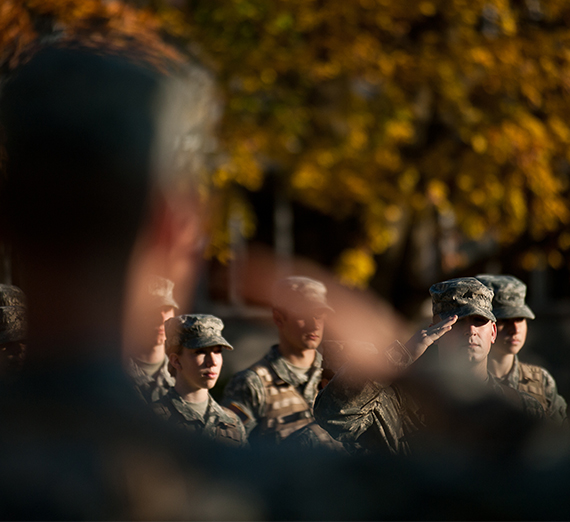 ROTC soldiers saluting.