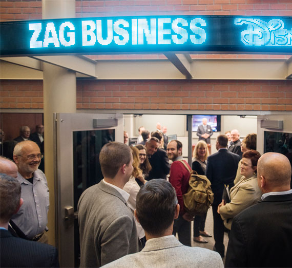 Richard poses in front of the Jepson Center sign
