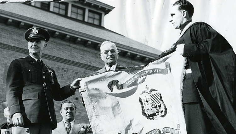 President Trumena presents ROTC Standard flag to University President Father Corkery