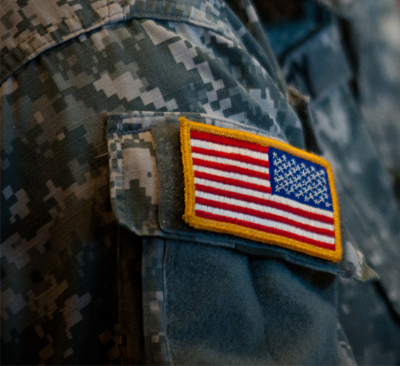 soldier's fatigues with flag patch 
