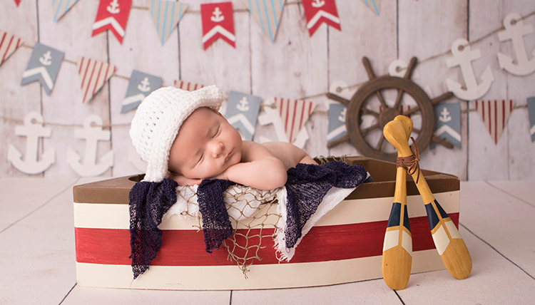 baby in sailor themed setting