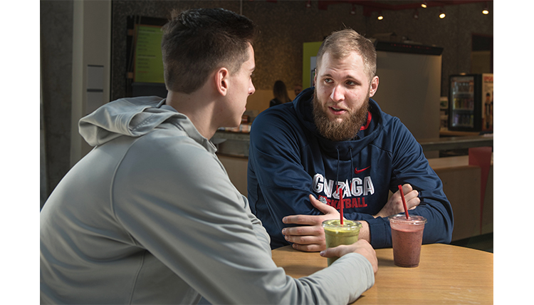 Gonzaga basketball giants Przemek Karnowski and Zack Collins drink protein shakes. 