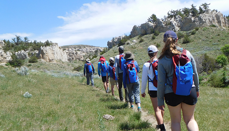 students hike through Montana wilderness