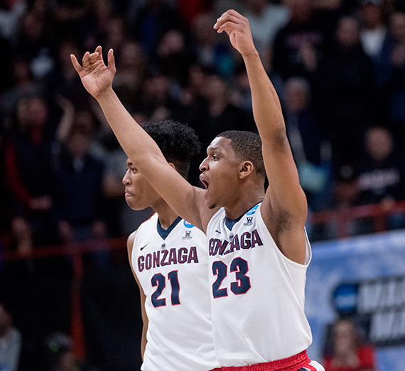(from left) Rui Hachimura and Zach Norvell Jr. celebrate their win Thursday over UNCG. (GU photo by Zack Berlat) 