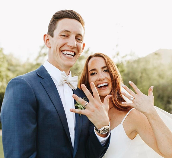 bride and groom embrace outdoors