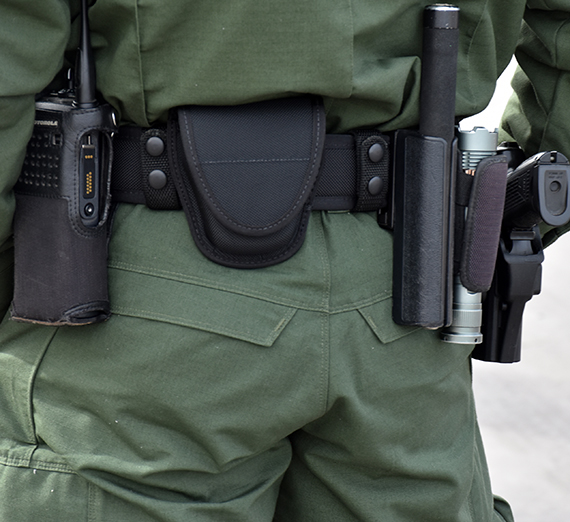 a border patrol agents belt with weapons 