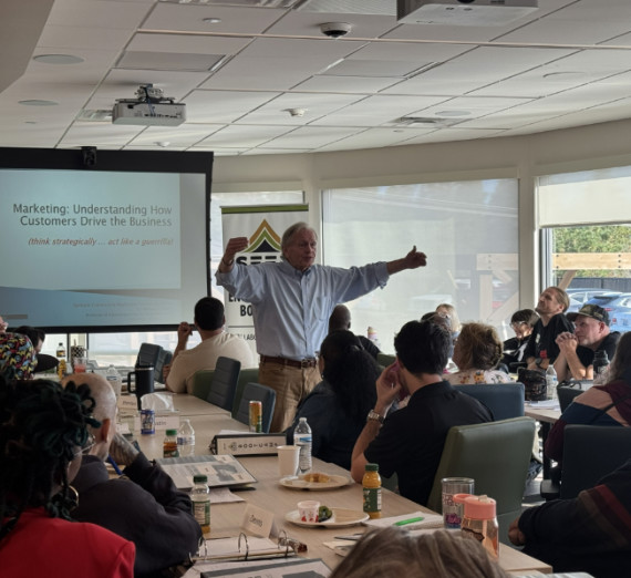 2 kayaks on the beach of the Spokane River at sunset