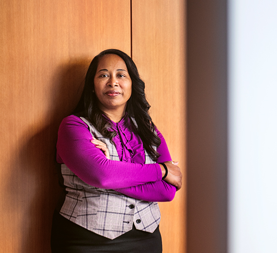 african american woman in bright magenta shirt