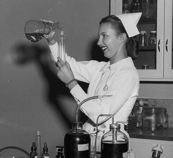 Women poses in nursing jacket.