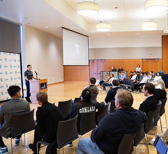 Katie and Ryan Harnetiaux stand in the Gonzaga Hall of Honor