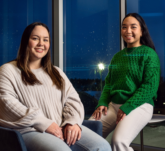 A woman with long hair  smiles at the camera