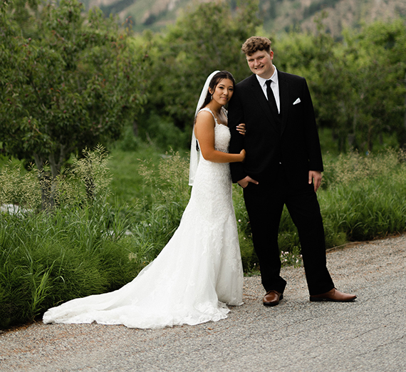 bride and groom embrace outdoors