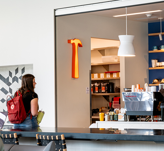 Wedding party poses with Gonzaga flag.