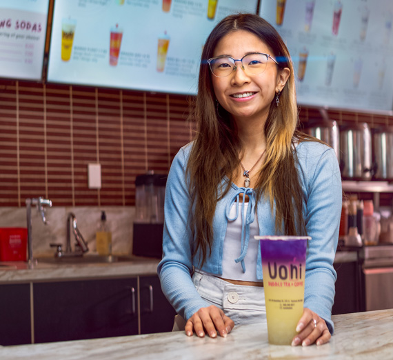 Kayla poses wearing a Gonzaga mask in the business school