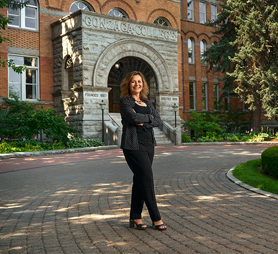 Alumna Melissa Koontz, class of 2012, sits at desk