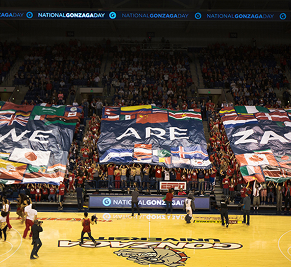 Gonzaga Students raise banners stating 