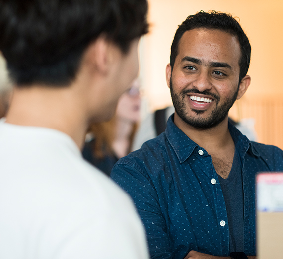 A leadership representative talks with a student.