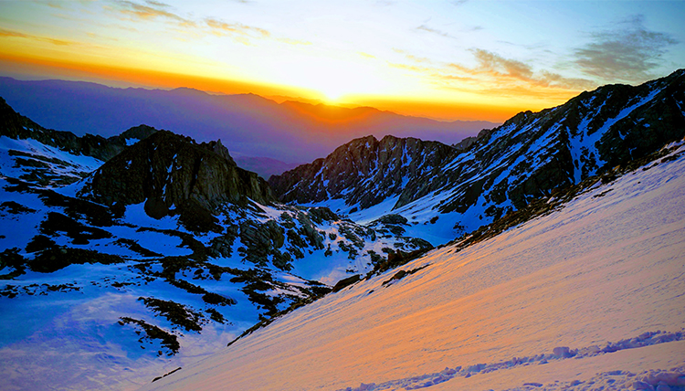 sunrise from the mountaintop with bright oranges and blues sunrise from the mountaintop with bright oranges and blues