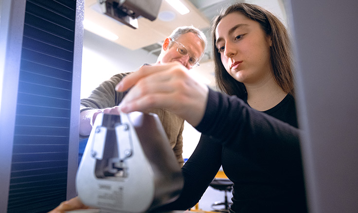 Student and professor in human physiology lab Student and professor in human physiology lab
