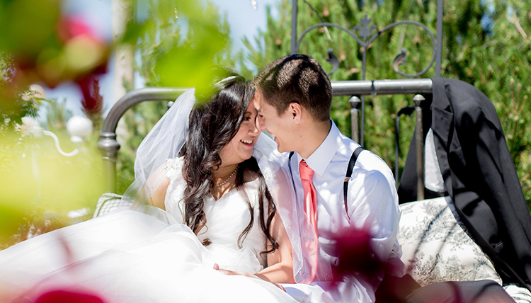 couple outdoors with flowers couple outdoors with flowers