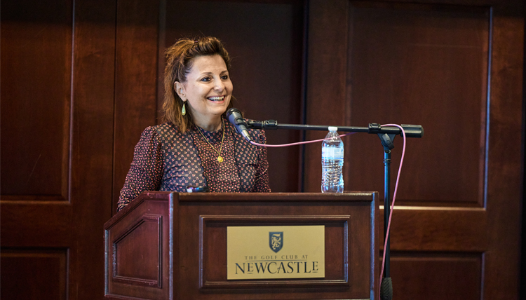 President Katia Passerini at the lectern