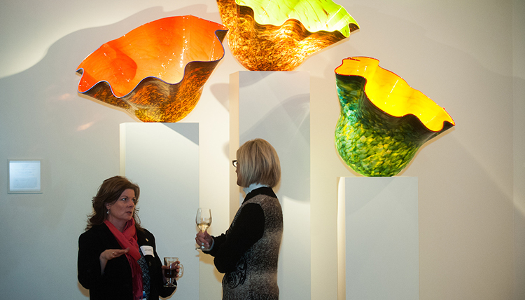 Visitors in front of Chihuly a glass exhibit at a special event in the Jundt Art Museum Visitors in front of Chihuly a glass exhibit at a special event in the Jundt Art Museum