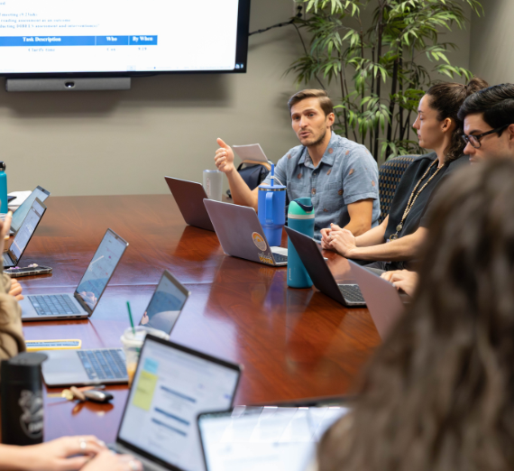 Dr. Gallo leads a student research team discussion