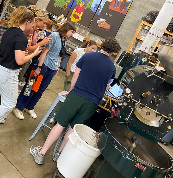 Students see roasting equipment Students see roasting equipment
