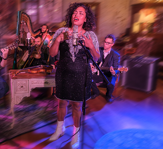 Mireya Ramos the the Poor Choices performing on stage. 