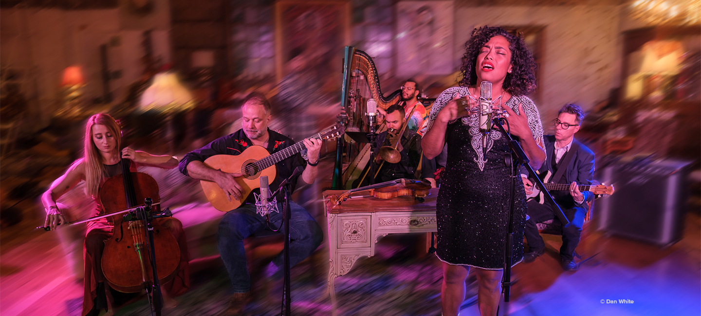 Mireya Ramos the the Poor Choices performing on stage. 