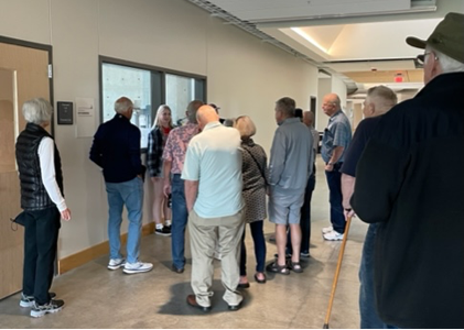 Class of 1964 and 1965 reunion group on a tour in the Bollier Center