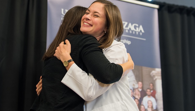 Family and friends join together to watch the newly admitted UW and Gonzaga University joint students receive their white coats on September 2nd, 2016 in the Hemmingson Center Ballroom at Gonzaga University. Family and friends join together to watch the newly admitted UW and Gonzaga University joint students receive their white coats on September 2nd, 2016 in the Hemmingson Center Ballroom at Gonzaga University.