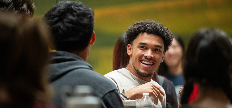 Student smiling with friends