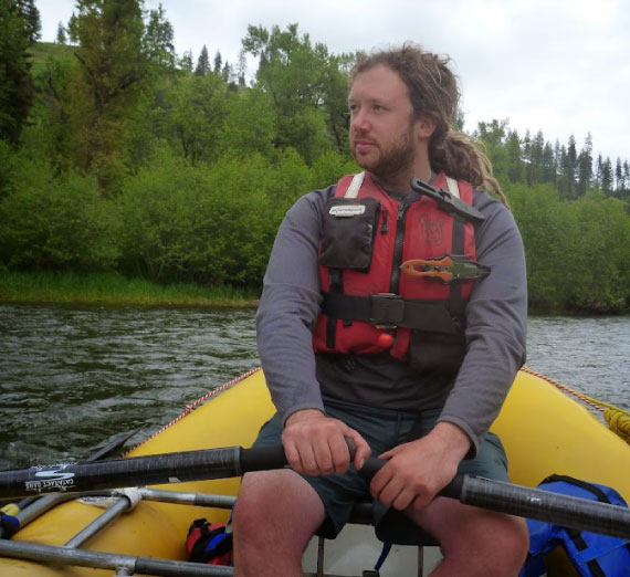 Jimmy Magnuson in a raft out on a river.