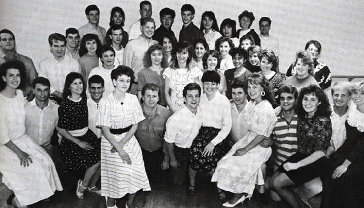 A group of students poses and smiles for a black and white photo. A group of students poses and smiles for a black and white photo.