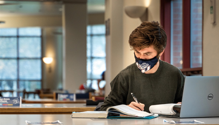 student studies with mask on student studies with mask on