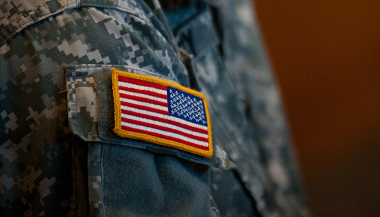 Flag on a military uniform at a veterans event on campus Flag on a military uniform at a veterans event on campus