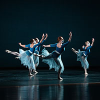 Four dancers on stage. Four dancers on stage.
