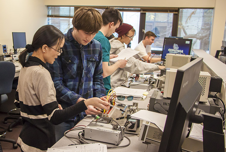 Dr. Mary Zhang and computer engineering students Dr. Mary Zhang and computer engineering students