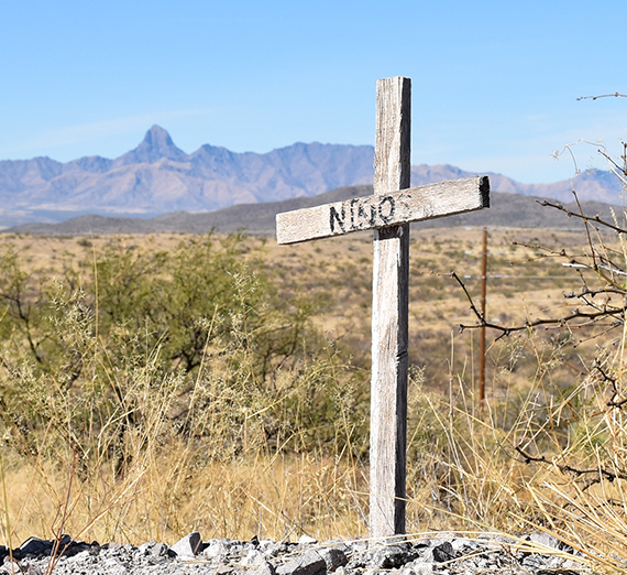 a cross in the desert reads 