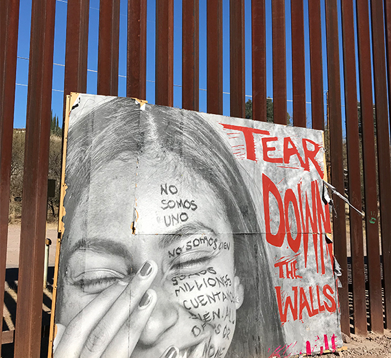 a sign at the wall separating Mexico from the U.S. reads 