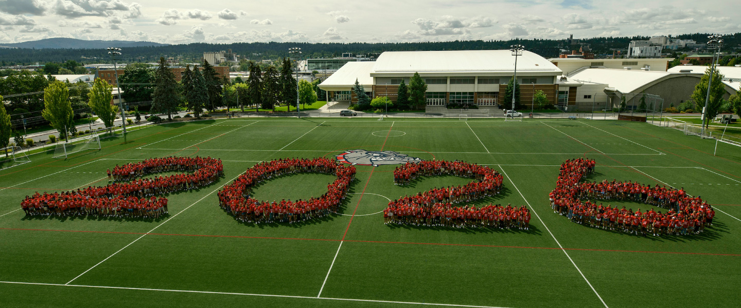 Gonzaga student stand together forming the number 