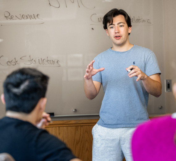 Student presenting in front of the class