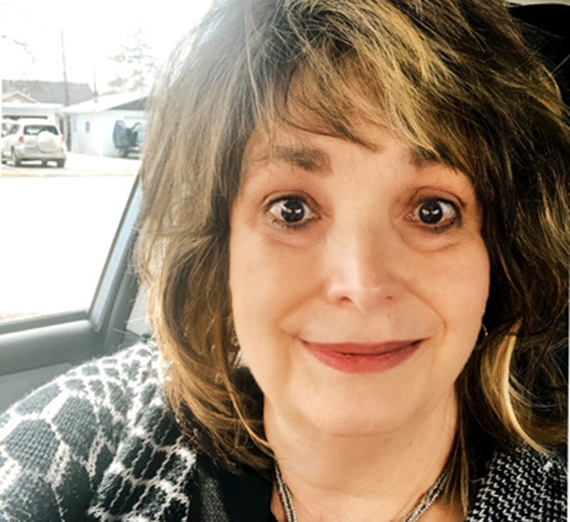 woman taking selfie in car