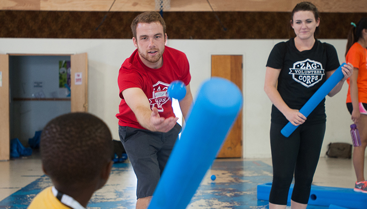 Members of the Zag Volunteer Corps play with children at the Boys and Girls Club. Members of the Zag Volunteer Corps play with children at the Boys and Girls Club.